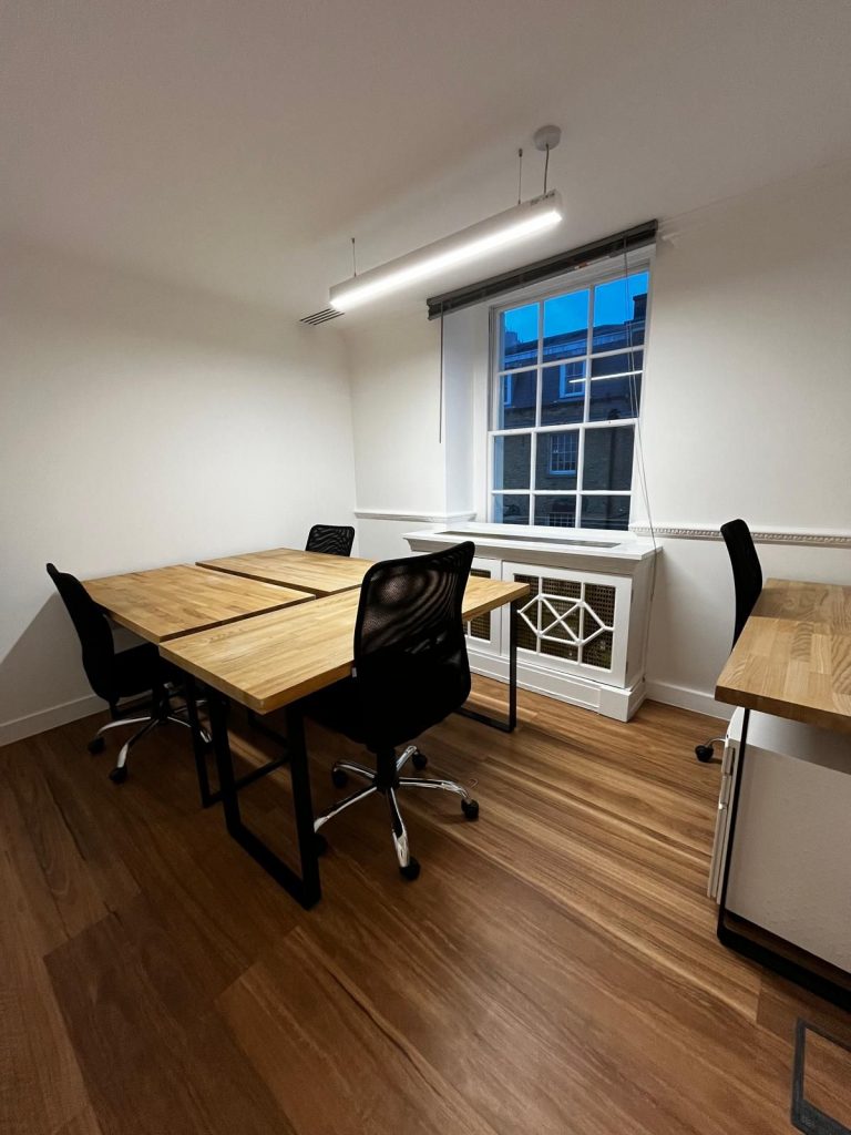 Serviced office in Mayfair – 3-desk workspace in Suite S1B with wood flooring, natural light, and modern furnishings.