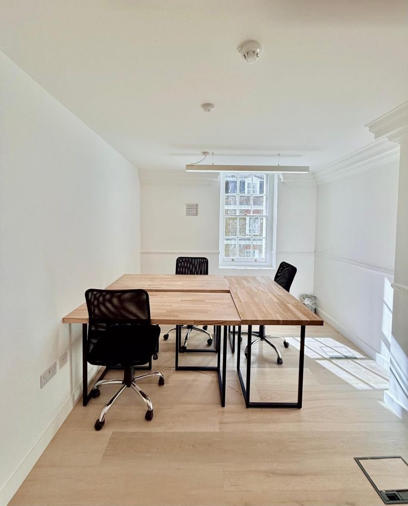 Modern office in London with 4 desks at office T1C, featuring bright natural light and minimalist design.