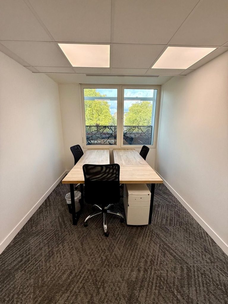 Central London private office rental – Suite 1B with modern desk setup and natural lighting at 33 Cavendish Square.