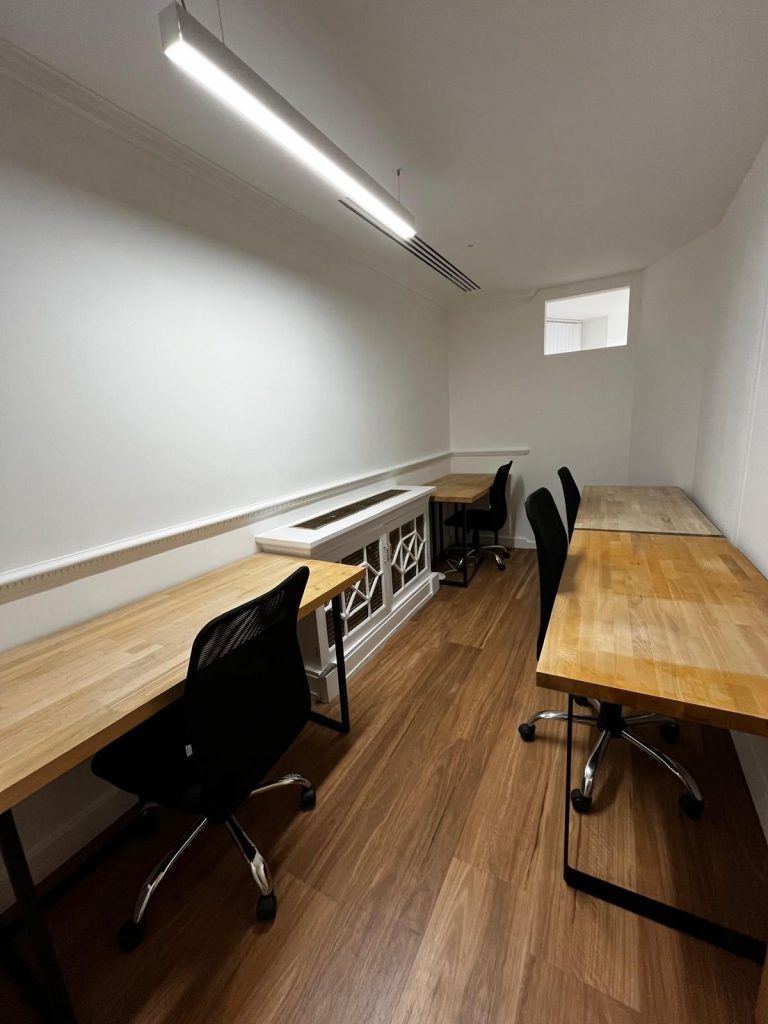 Mayfair workspace for small team – Suite S1E with 3 desks, wood flooring, and a modern layout in a private 90 sq ft serviced office.