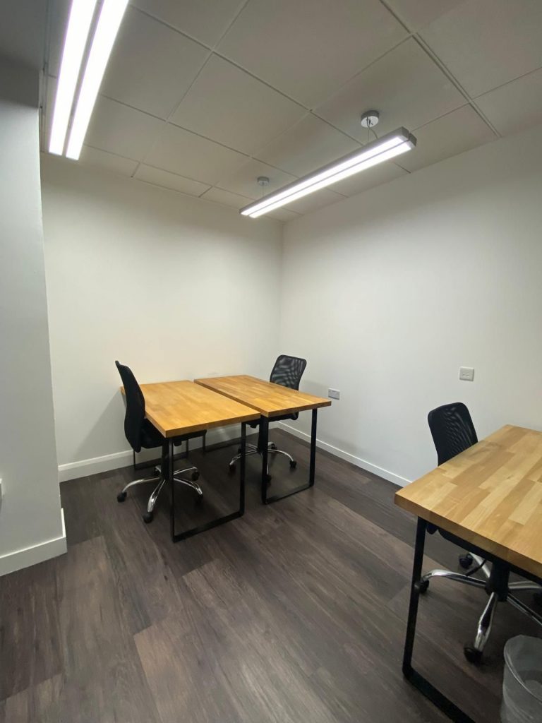 Bright and modern private workspace in Knightsbridge featuring a 4-desk setup, ideal for small teams looking for a professional office near Hyde Park Corner.
