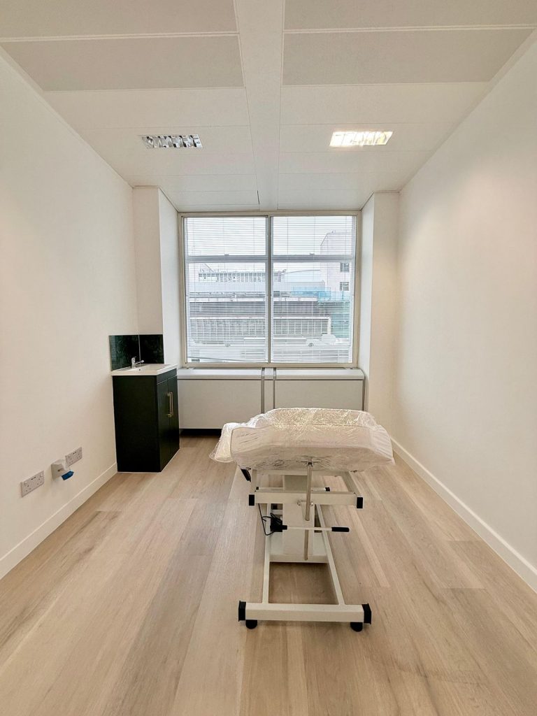 Private healthcare room in London with treatment chair and clinical sink setup